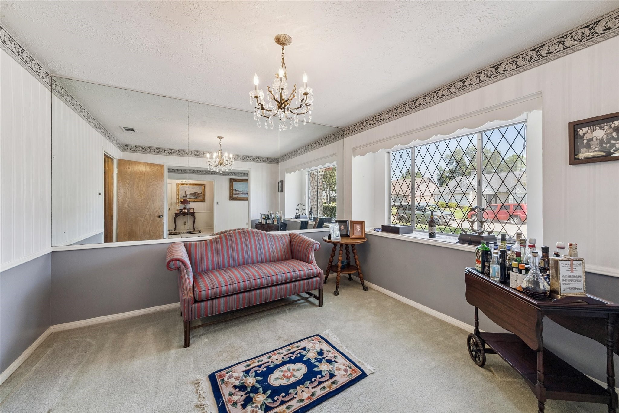 3019 Stetson Lane Houston, TX 77043 - Photo 8 of 28 Charming space featuring vintage details, a large decorative window, and abundant natural light.