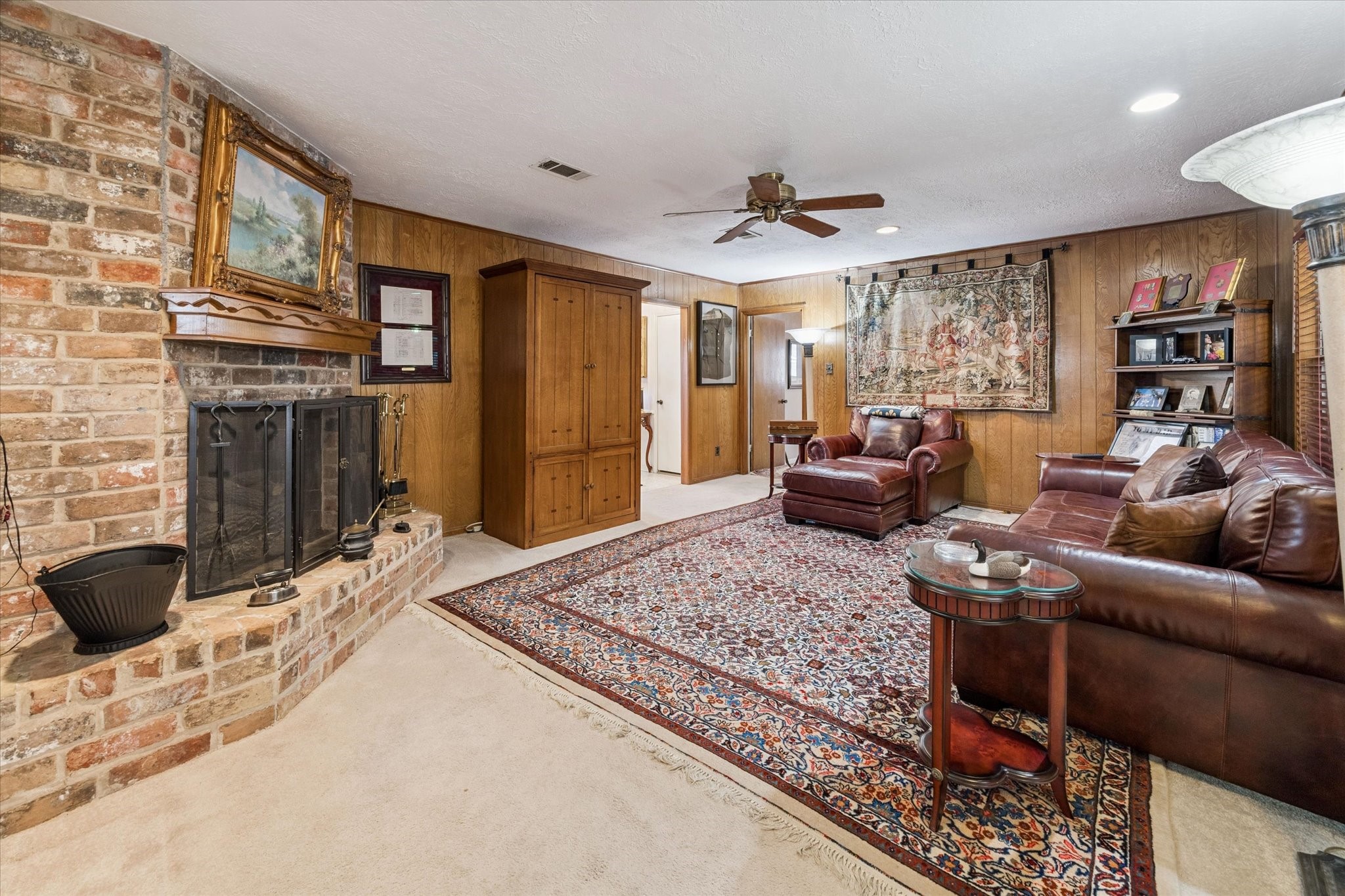 3019 Stetson Lane Houston, TX 77043 - Photo 10 of 28 Spacious family room with a charming fireplace, perfect for gatherings.