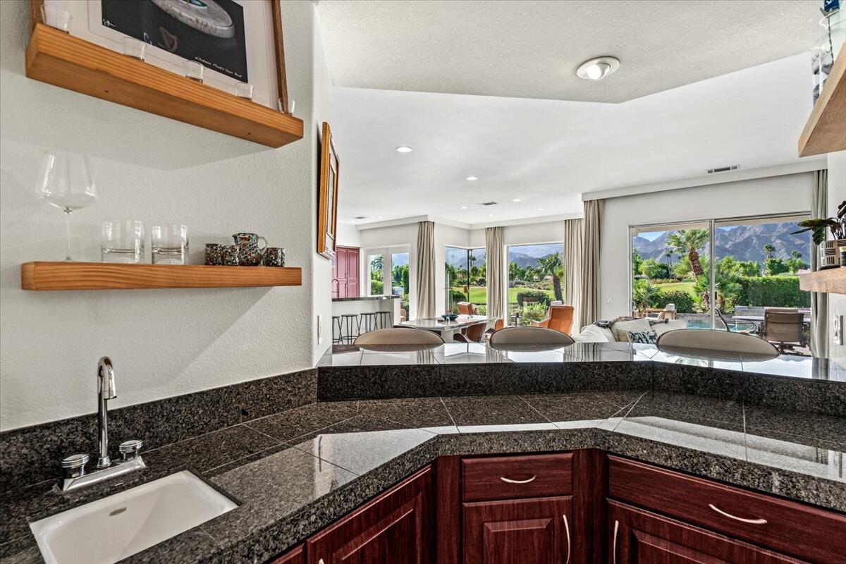 54695 Winged Foot La Quinta, CA 92253 - Photo 11 of 51 a kitchen with a sink and large window