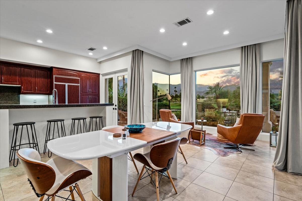 54695 Winged Foot La Quinta, CA 92253 - Photo 15 of 51 a view of a dining room with furniture window and outside view
