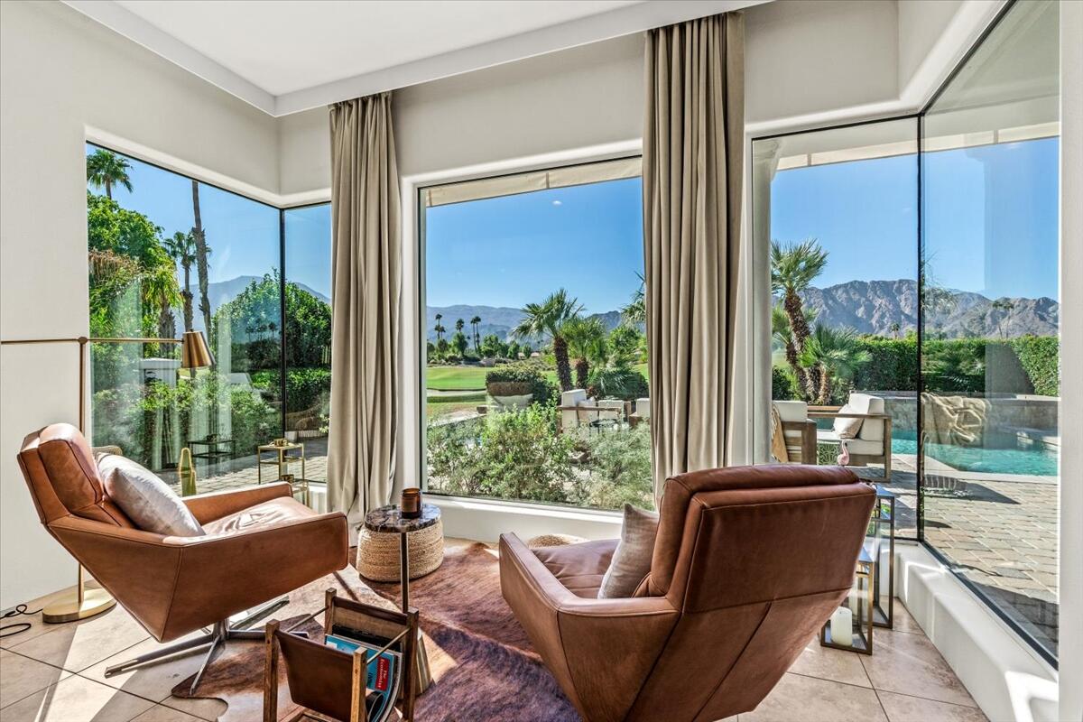 54695 Winged Foot La Quinta, CA 92253 - Photo 16 of 51 a living room with patio furniture and garden view