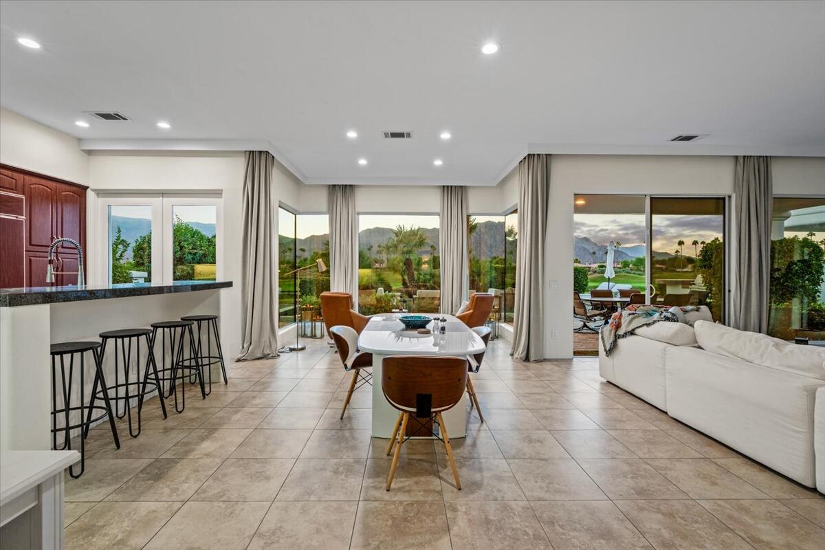 54695 Winged Foot La Quinta, CA 92253 - Photo 18 of 51 a living room with furniture and large windows