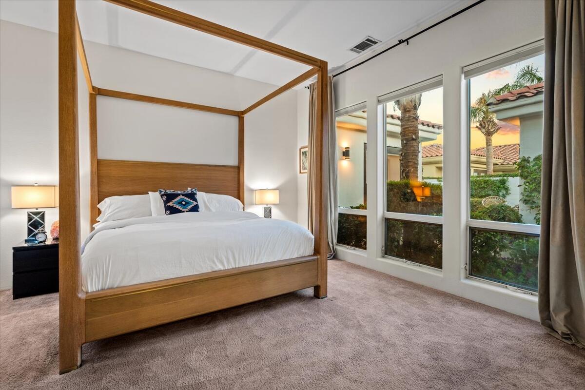 54695 Winged Foot La Quinta, CA 92253 - Photo 28 of 51 a bed sitting in a spacious bedroom next to a window