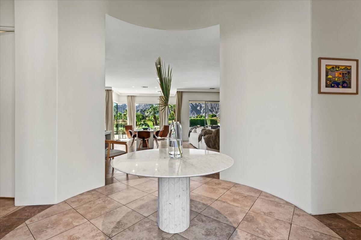 54695 Winged Foot La Quinta, CA 92253 - Photo 31 of 51 a dining room with table and chairs