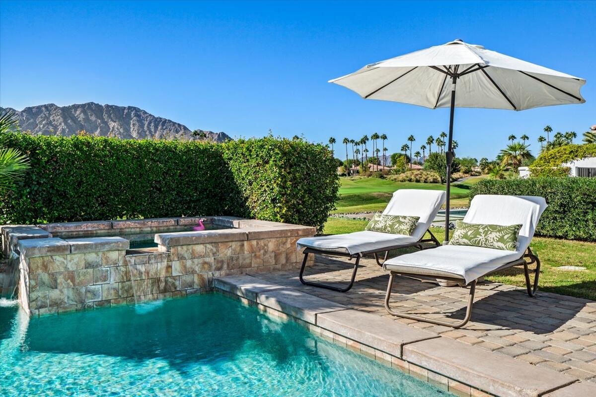 54695 Winged Foot La Quinta, CA 92253 - Photo 43 of 51 a view of a chairs and table in the backyard