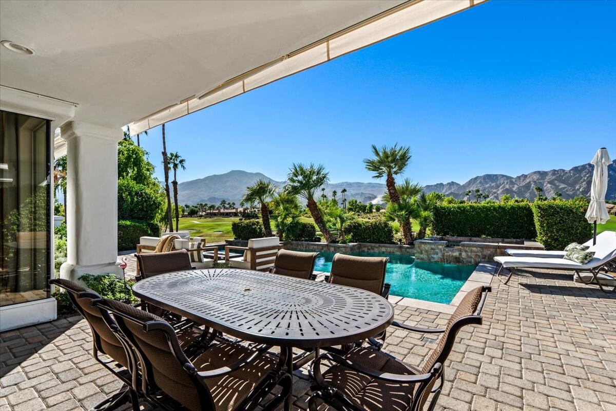 54695 Winged Foot La Quinta, CA 92253 - Photo 44 of 51 a view of a patio with a table and chairs