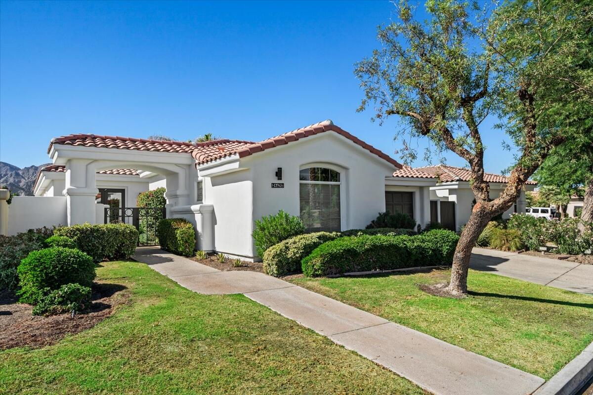 54695 Winged Foot La Quinta, CA 92253 - Photo 50 of 51 a front view of a house with a yard