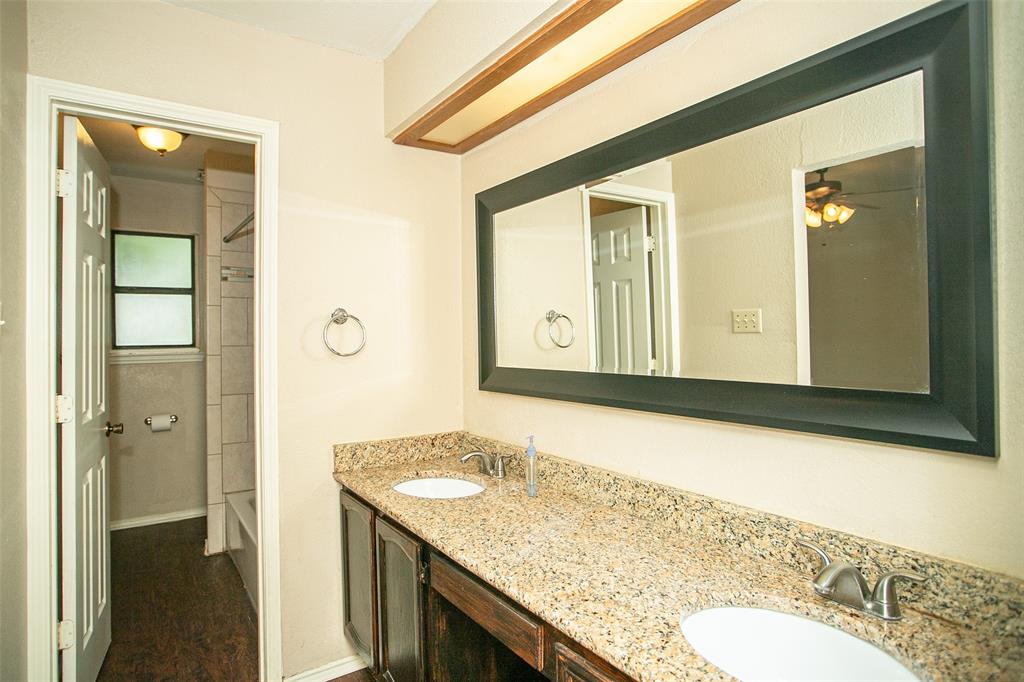 2019 West Nathan Lowe Road Arlington, TX 76017 - Photo 17 of 21 Dual vanity with stone-finish countertop and undermount sinks
