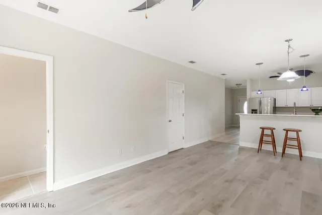 a view of a hallway with white walls