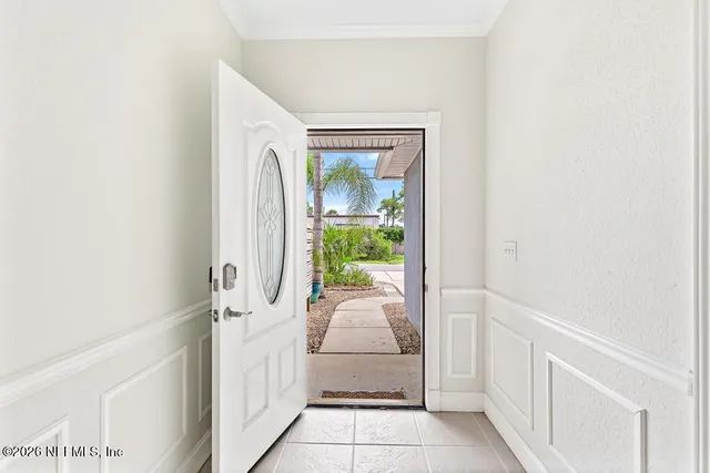 a view of a livingroom with a fireplace and window