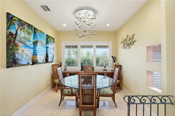 a view of a dining room with furniture window and outside view