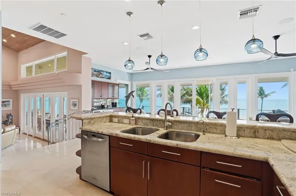 a view of ocean with a palm tree