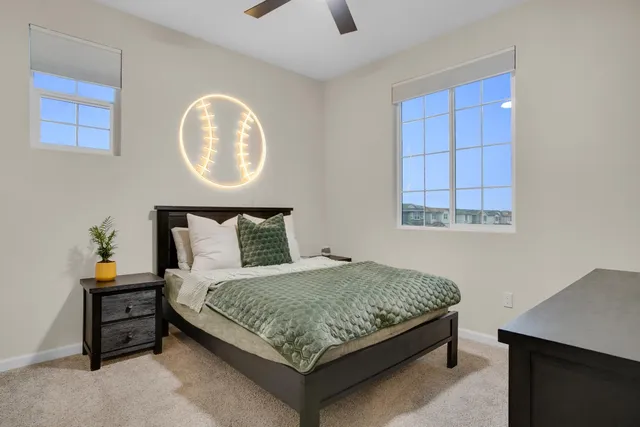 a bedroom with a bed and window