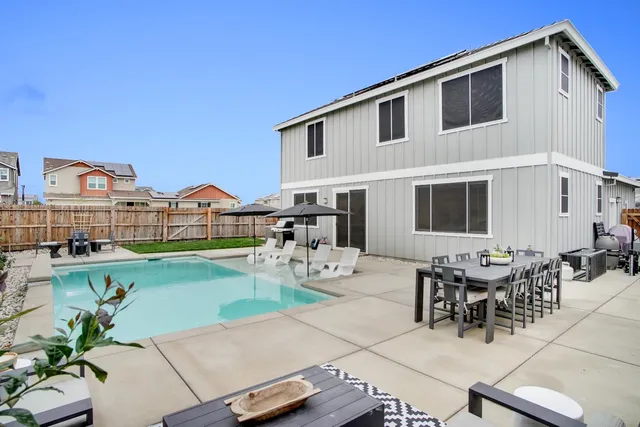 a backyard of a house with seating space