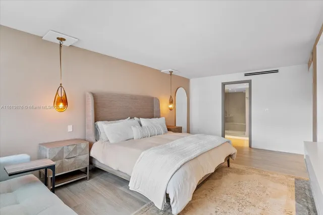 a bedroom with bed and window