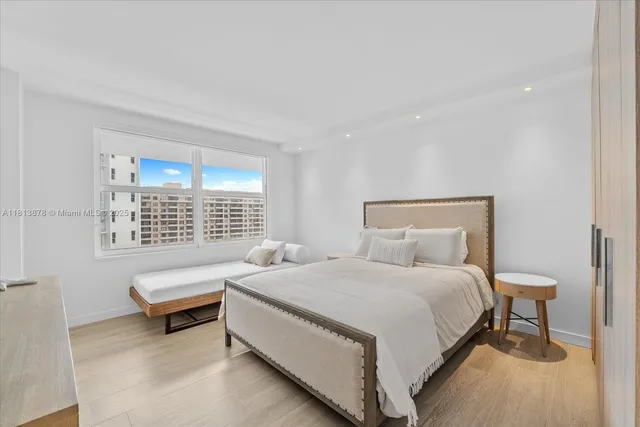 a bedroom with a bed and a couch