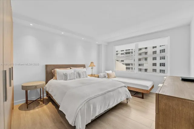 a bedroom with a bed and a table with chair