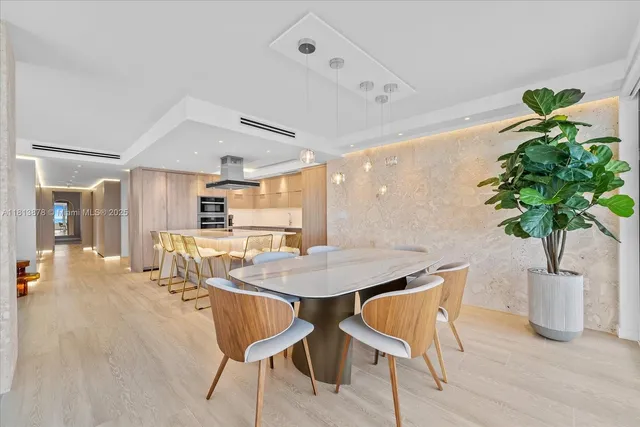a dining room with furniture and wooden floor