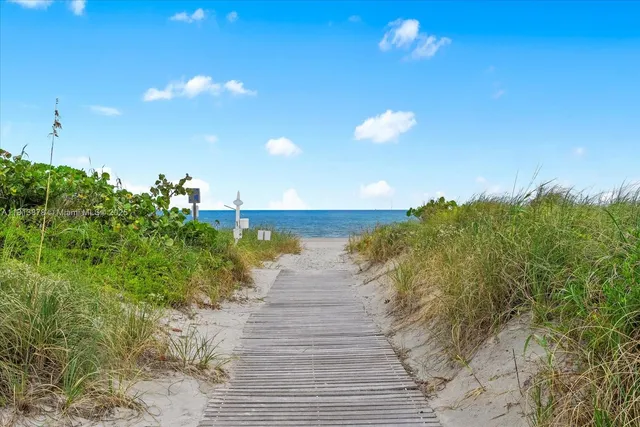 a view of a lake with a garden