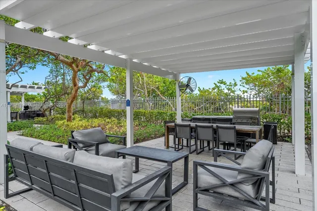 a view of pool with outdoor seating