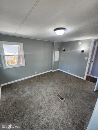 en empty room with windows