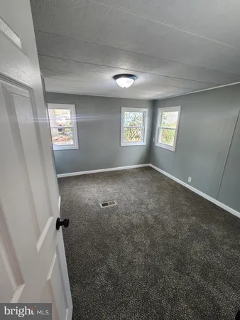 a view of a hallway with a window