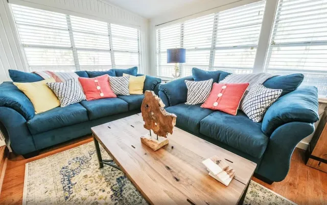 a living room with furniture and a large window