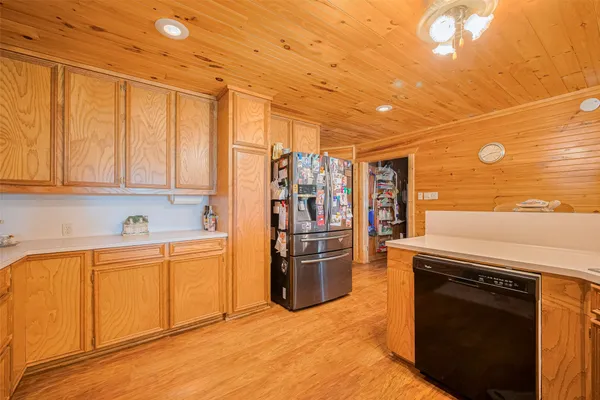 a kitchen with stainless steel appliances a stove and a refrigerator