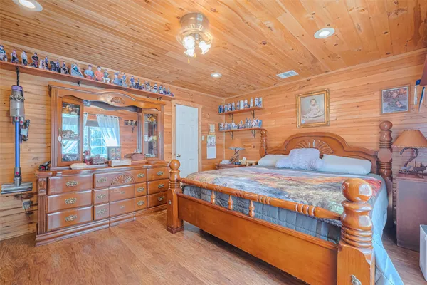 a bedroom with bed and window