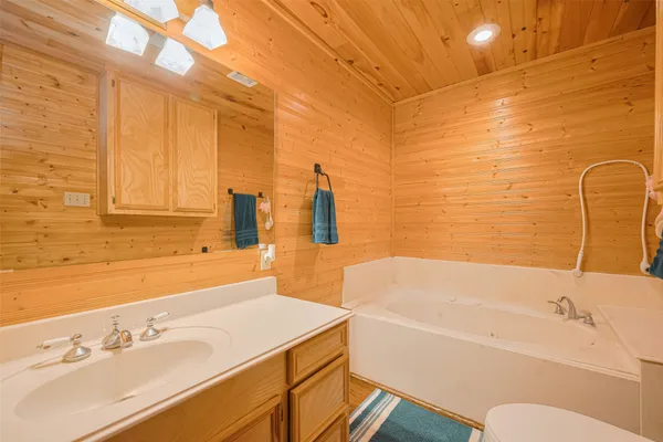a bathroom with a sink and a bathtub