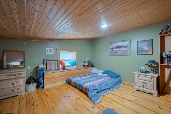 a bedroom with a bed and furniture