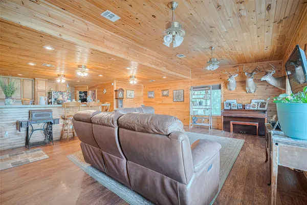 a living room with furniture a fireplace and a counter top space