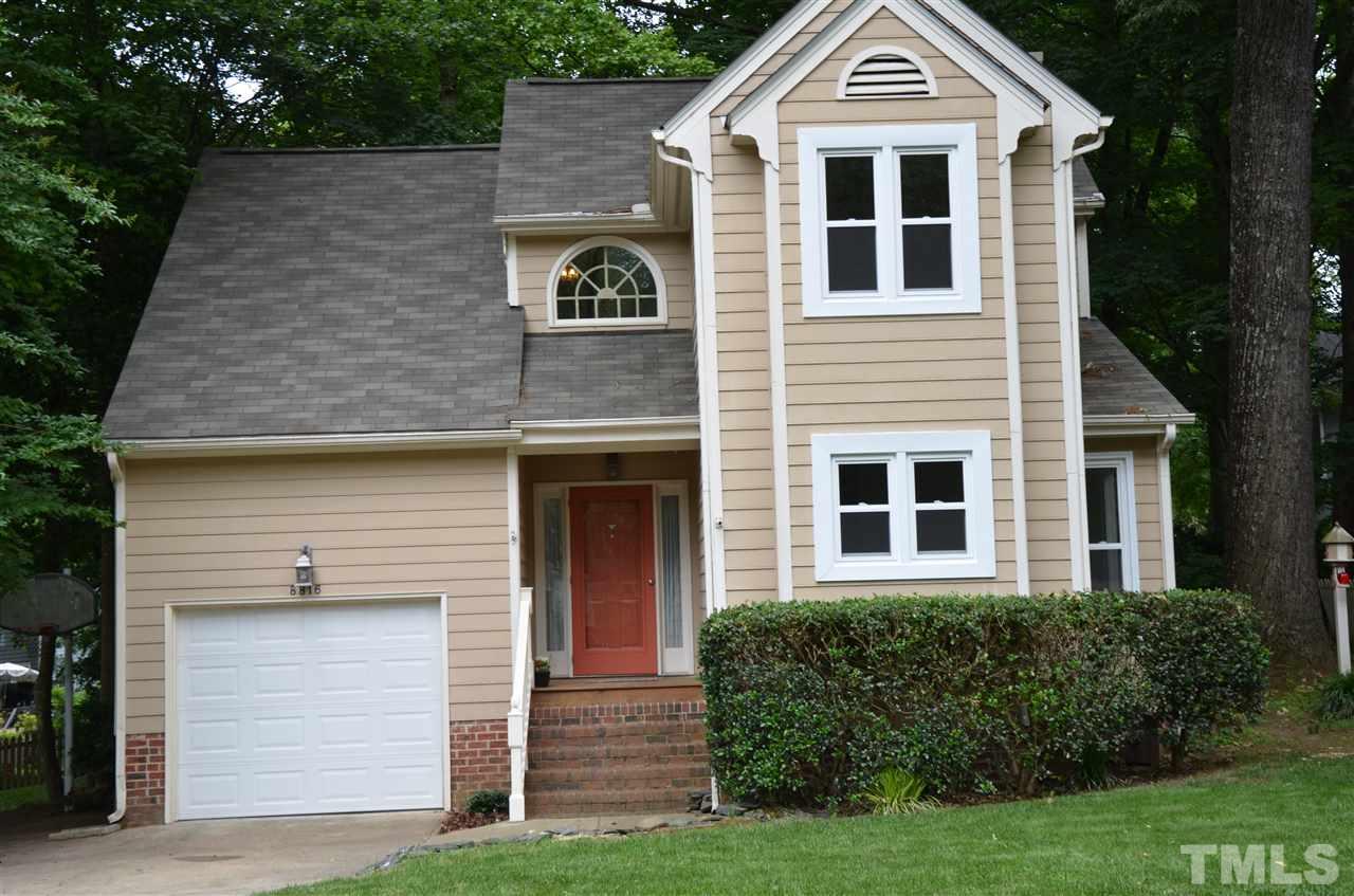8816 Life Lane Raleigh, NC 27615 - Photo 1 of 25 a front view of a house with a yard