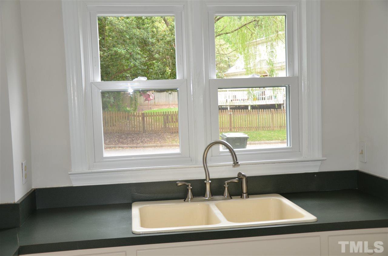 8816 Life Lane Raleigh, NC 27615 - Photo 12 of 25 a sink sitting next to a window
