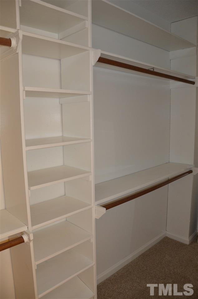 8816 Life Lane Raleigh, NC 27615 - Photo 19 of 25 a view of an empty walk in closet