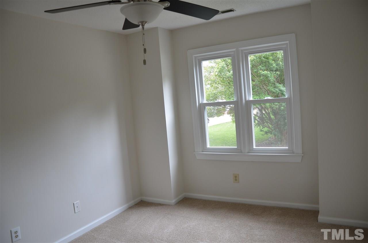 8816 Life Lane Raleigh, NC 27615 - Photo 20 of 25 an empty room with a window