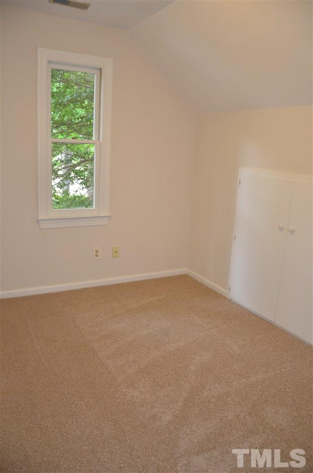 8816 Life Lane Raleigh, NC 27615 - Photo 22 of 25 an empty room with a window