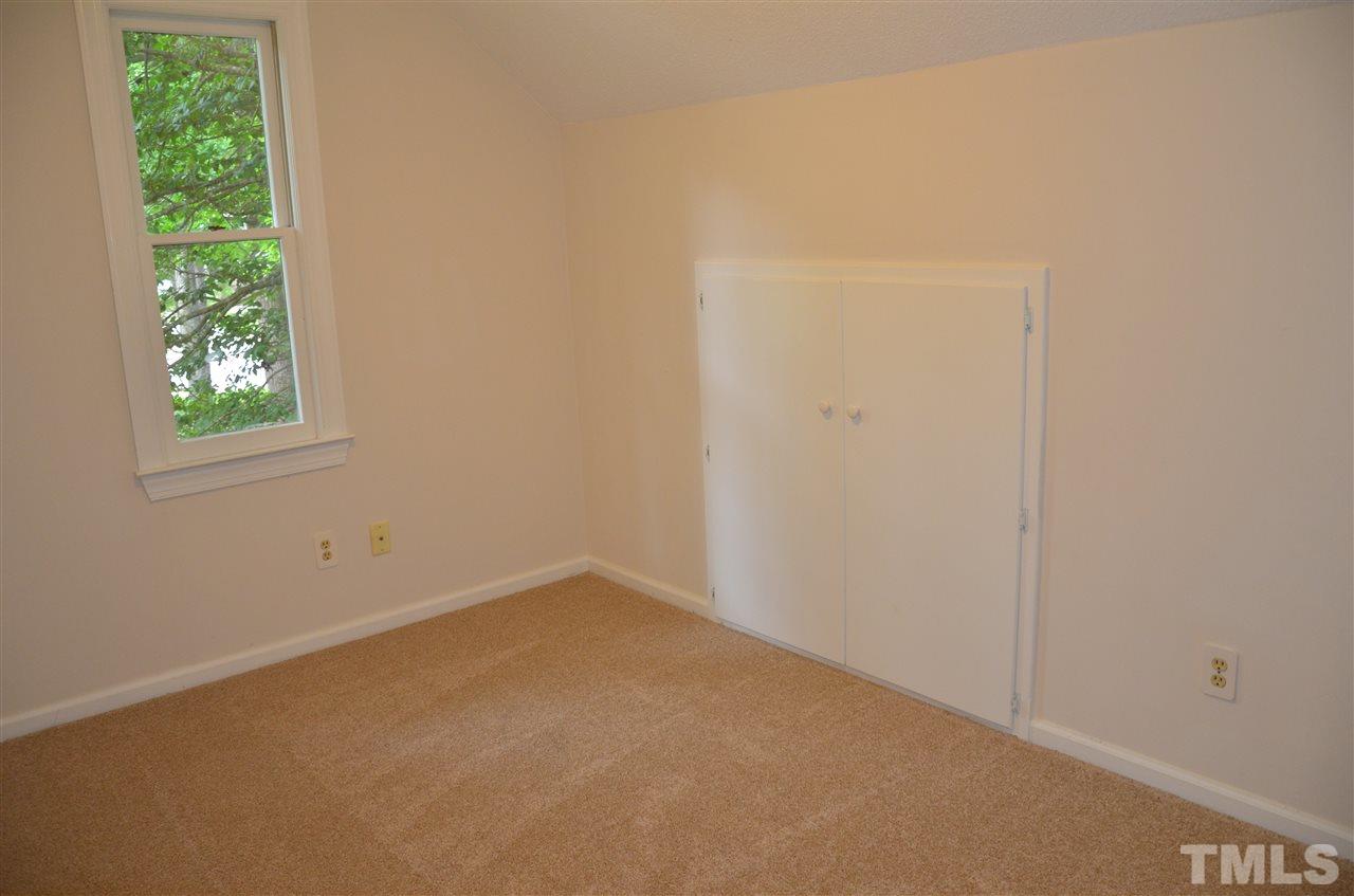 8816 Life Lane Raleigh, NC 27615 - Photo 23 of 25 an empty room with a window