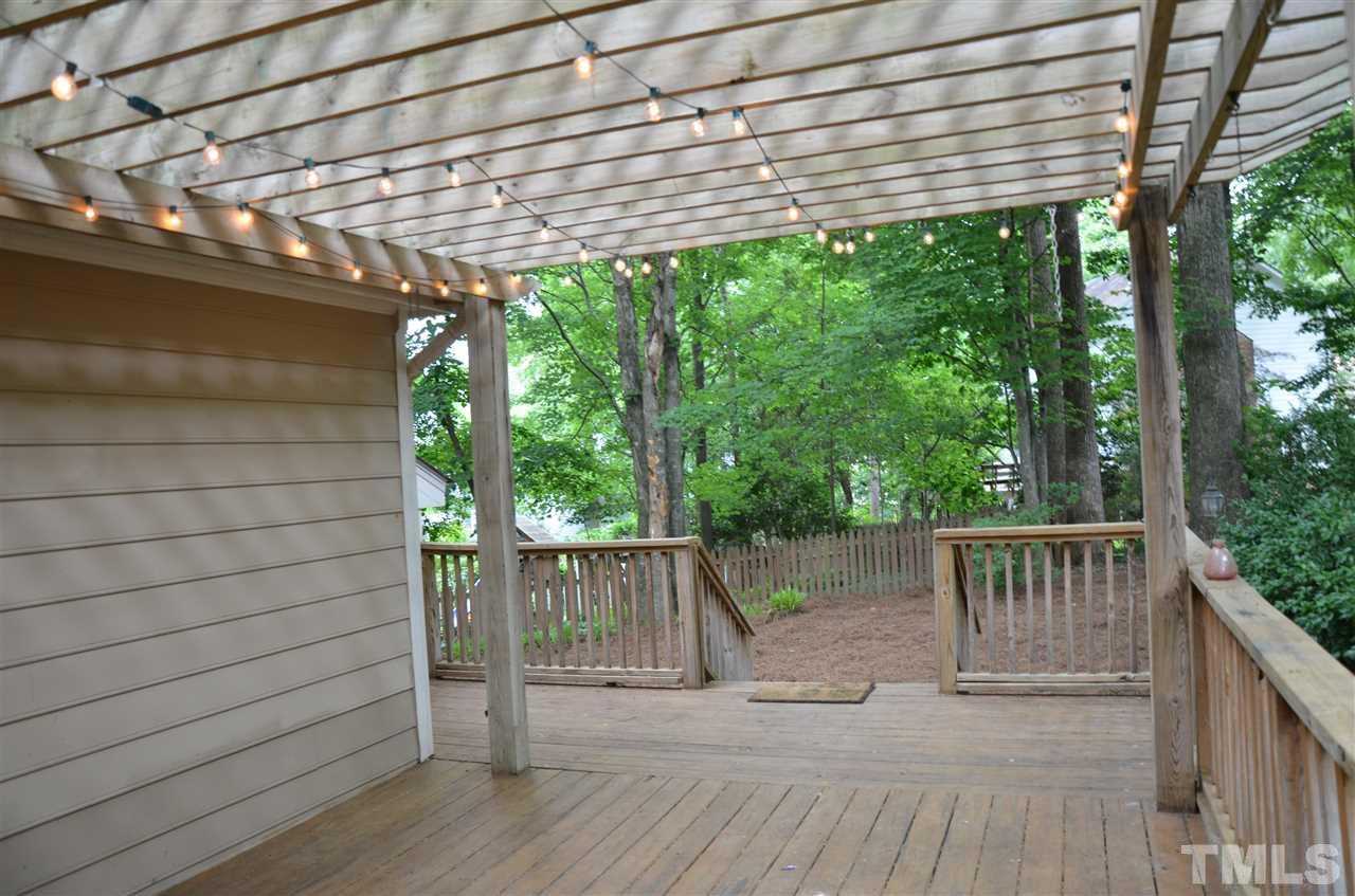 8816 Life Lane Raleigh, NC 27615 - Photo 4 of 25 a view of a wooden deck
