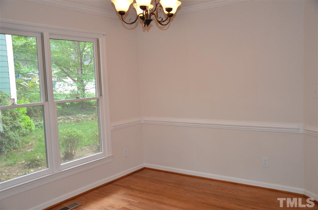 8816 Life Lane Raleigh, NC 27615 - Photo 8 of 25 a view of a small space with wooden floor and windows