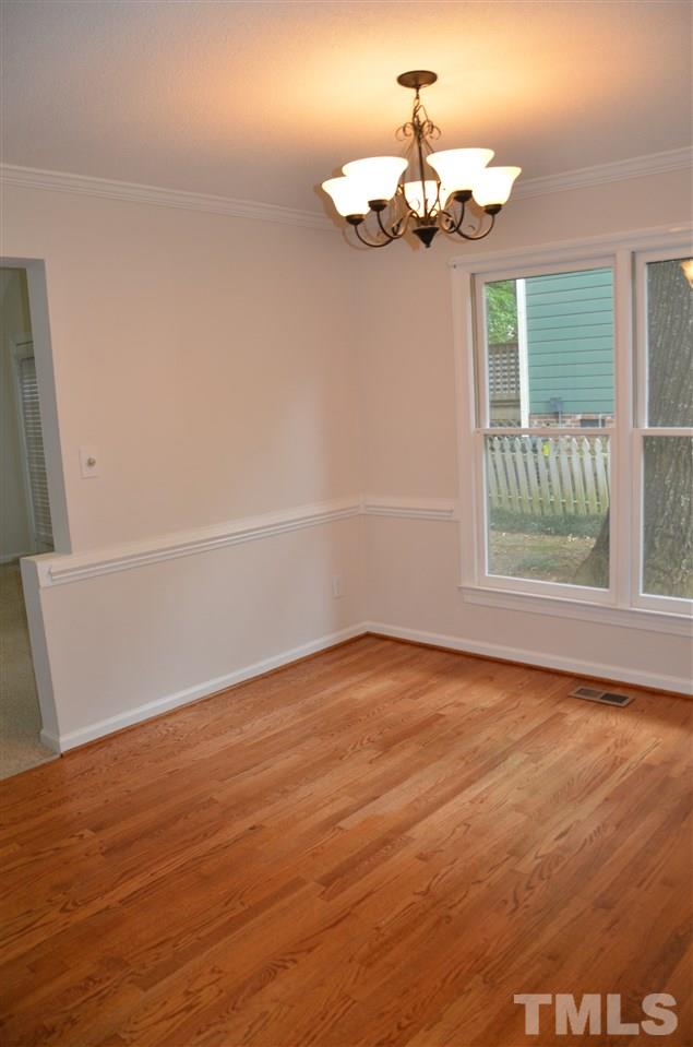 8816 Life Lane Raleigh, NC 27615 - Photo 9 of 25 a view of an empty room with a window