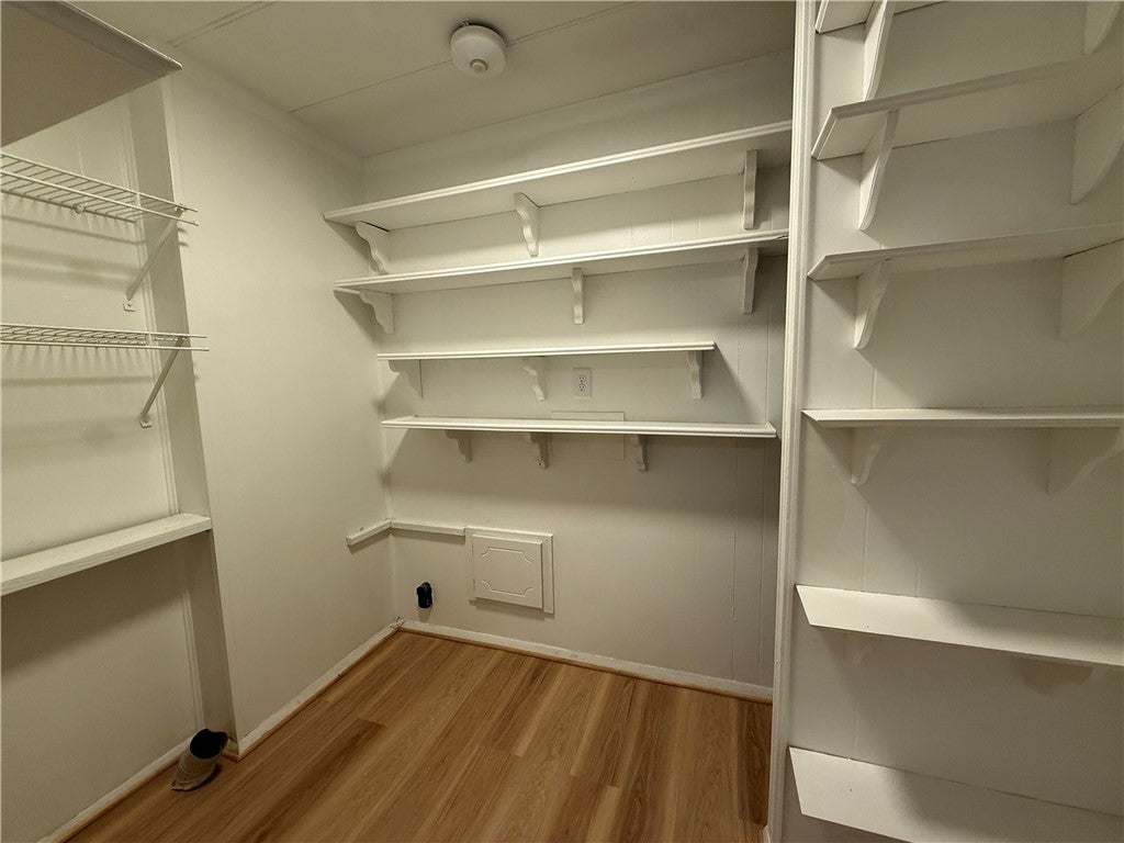 306 Crawford Road Opelika, AL 36804 - Photo 8 of 31 This spacious closet offers ample shelving and versatile storage options for any wardrobe.
