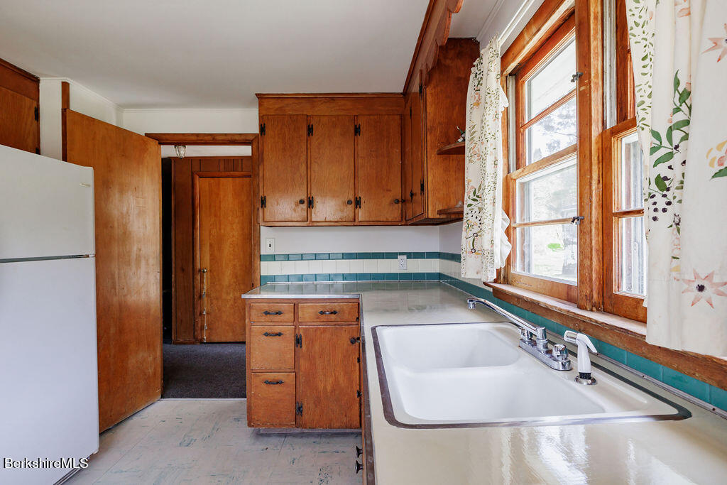 45 Swamp Road West Stockbridge, MA 01266 - Photo 12 of 56 a bathroom with a tub sink and mirror