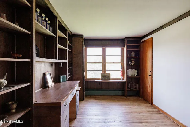 a bed room with a bed chair and a window