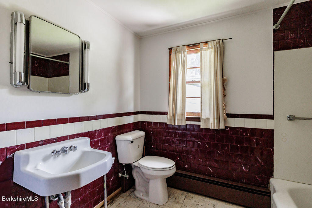 45 Swamp Road West Stockbridge, MA 01266 - Photo 21 of 56 a bathroom with a sink toilet and mirror