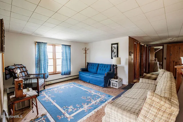 a balcony with table and chairs