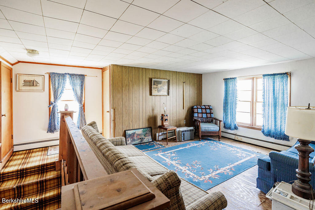 45 Swamp Road West Stockbridge, MA 01266 - Photo 29 of 56 a living room with furniture a rug and a window