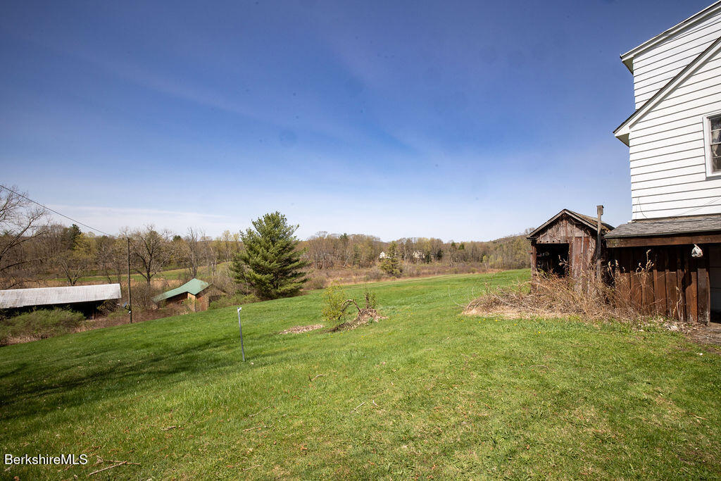 45 Swamp Road West Stockbridge, MA 01266 - Photo 42 of 56 a backyard of a house with table and chairs