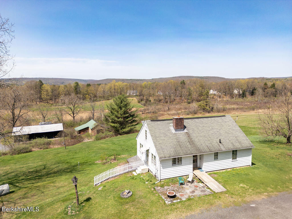 45 Swamp Road West Stockbridge, MA 01266 - Photo 45 of 56 a view of a house with a yard and sitting area