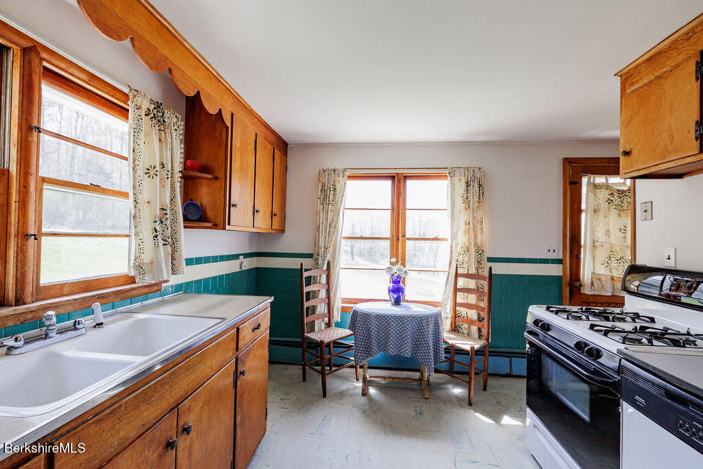 45 Swamp Road West Stockbridge, MA 01266 - Photo 10 of 56 a kitchen that has a sink and a stove